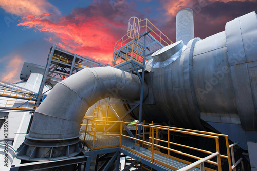 Photography cement plant factory manufacturing have clinker cooler and other plant  at sunset