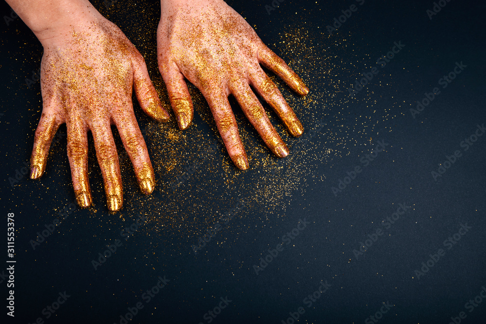 Beautiful man's hands in golden