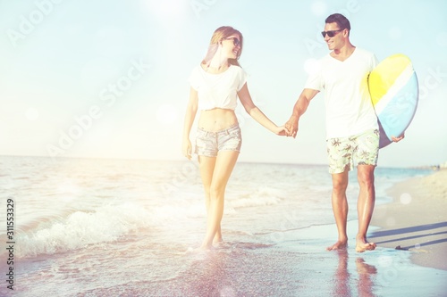 Lovely happy couple hugging on the seacoast background © BillionPhotos.com