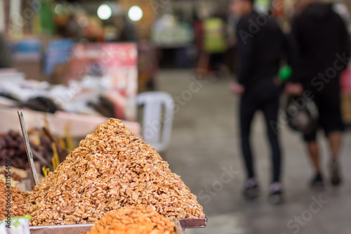 Fototapeta Naklejka Na Ścianę i Meble -  Roasted walnuts peeled in pile, isolated on blurred background