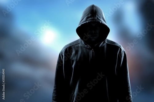 Obraz na plátně Thief in black clothes on bokeh background
