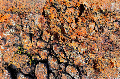 Detailed close up view on aged and weathered rusty metallic walls photo