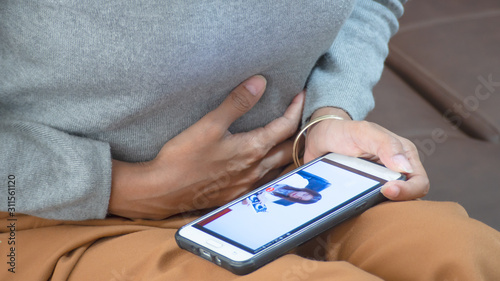 In screen mobile, The doctor is talking to the patient. At the video call to consult illnesses. Concept of consulting health problems or doctors online.