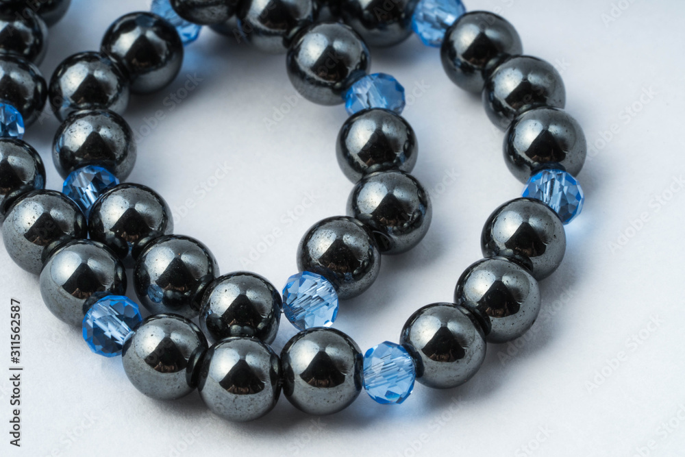 Necklace made of hematite and blue glass rondels Necklace made of hematite and blue glass rondels