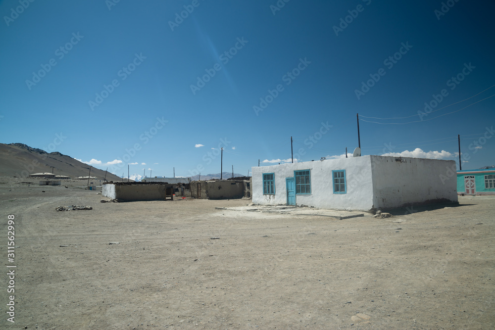 Poor village on the Pamir highway in Tajikistan Poor village on the Pamir highway in Tajikistan
