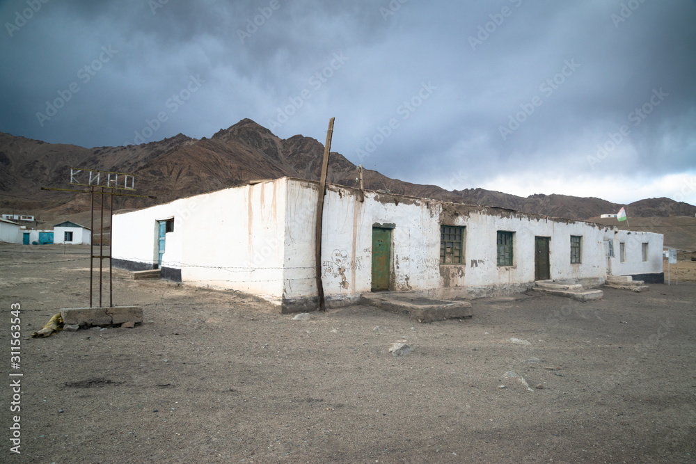 Poor village on the Pamir highway in Tajikistan Poor village on the Pamir highway in Tajikistan