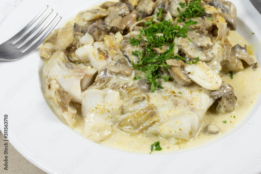 saithe fillet, mushrooms in white wine sauce saithe fillet, mushrooms in white wine sauce