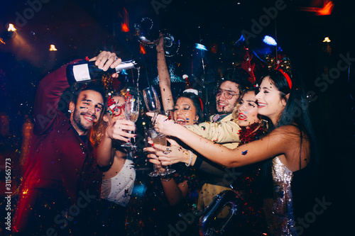 Group of friends having fun at New Year's party