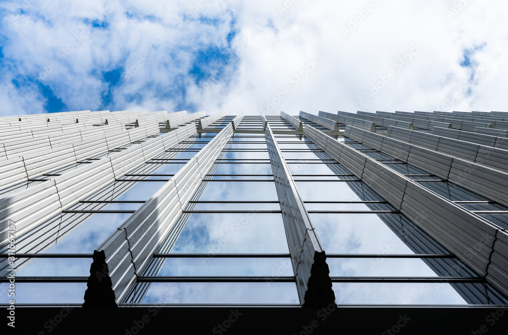 modern steel and glass silhouettes of skyscraper building with blue sky perspective modern steel and glass silhouettes of skyscraper building with blue sky perspective
