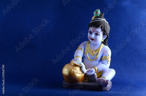 Hindu God Krishna on blue background