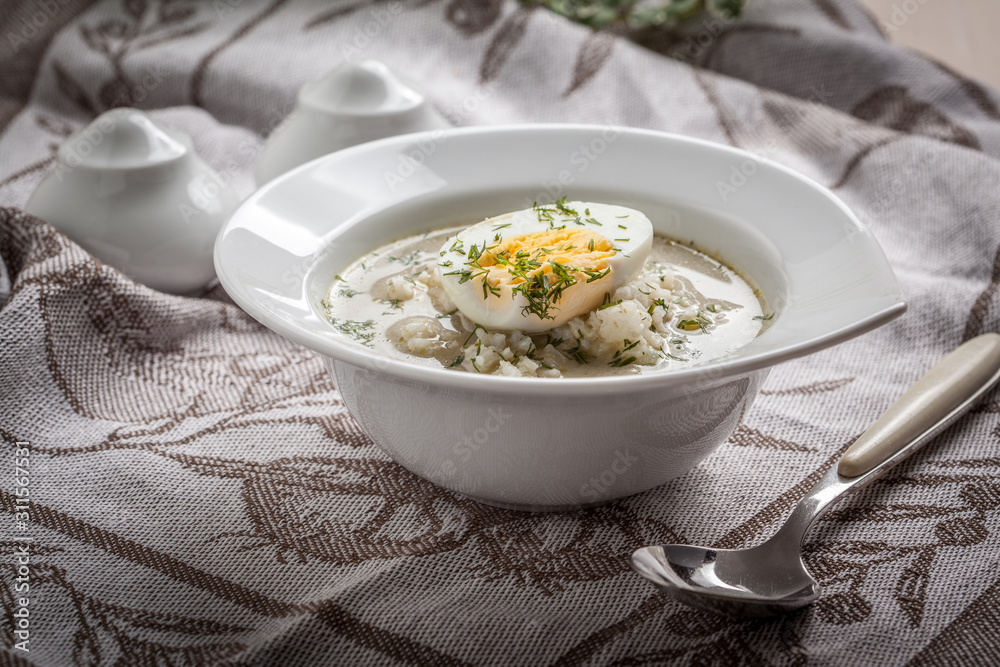 Sorrel soup with egg in white bowl. Sorrel soup with egg in white bowl.