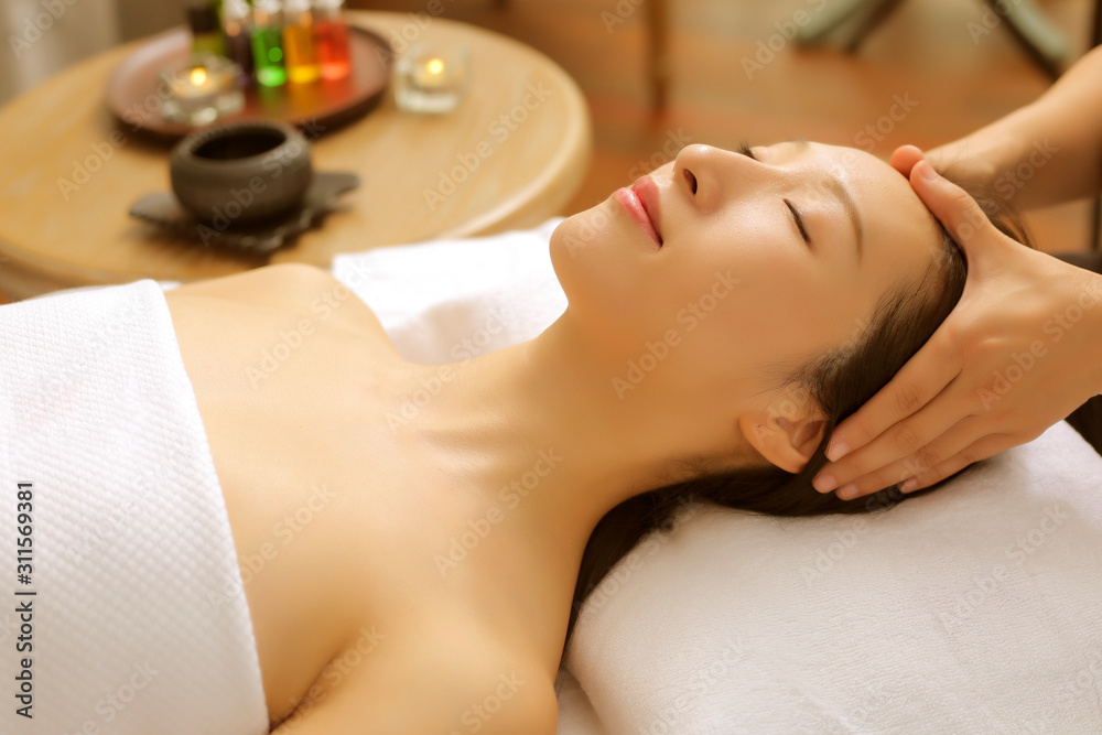 Asian women are enjoying head and face massage at spa Asian women are enjoying head and face massage at spa