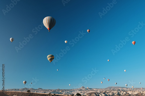 Hot air balloon flying over rock landscape at Cappadocia Turkey © romablack