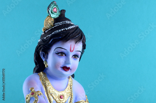 Hindu God Krishna on blue background