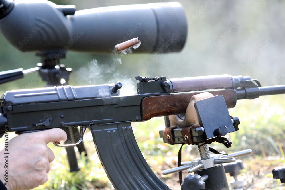 Ejecting cartridge case with smoke Ejecting cartridge case with smoke