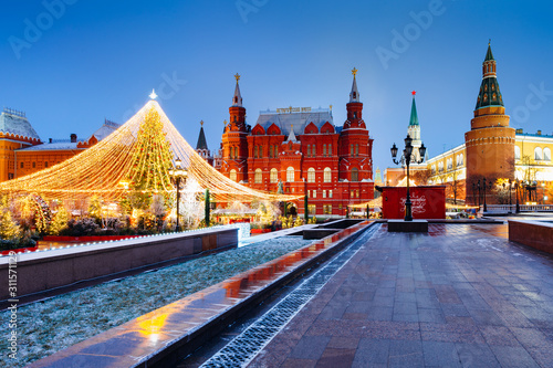 The State Historical Museum and The Kremlin with Christmas tree on the foreground, Moscow, Russia