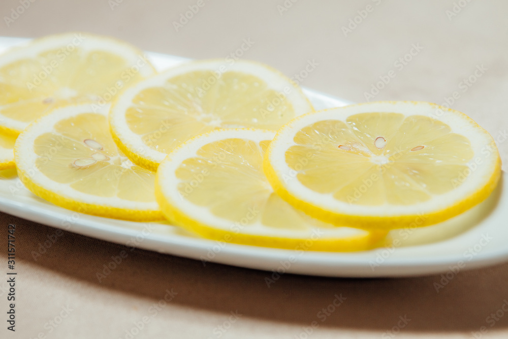 sliced lemon in a white plate sliced lemon in a white plate