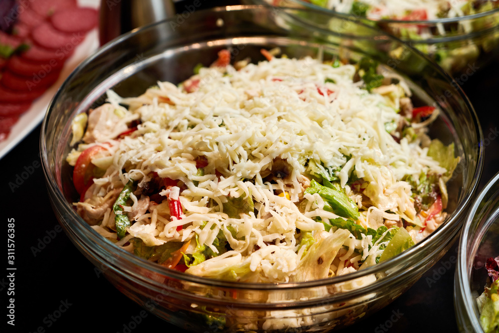Salad with grated cheese, lettuce leaves, fresh paprika Salad with grated cheese, lettuce leaves, fresh paprika