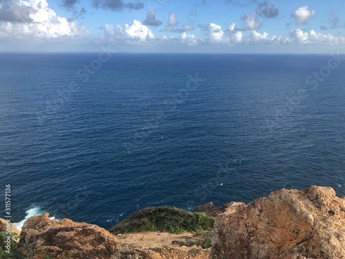sea and blue sky seen from a cliff