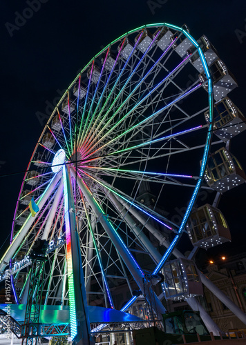 Colorful ferris wheel at night