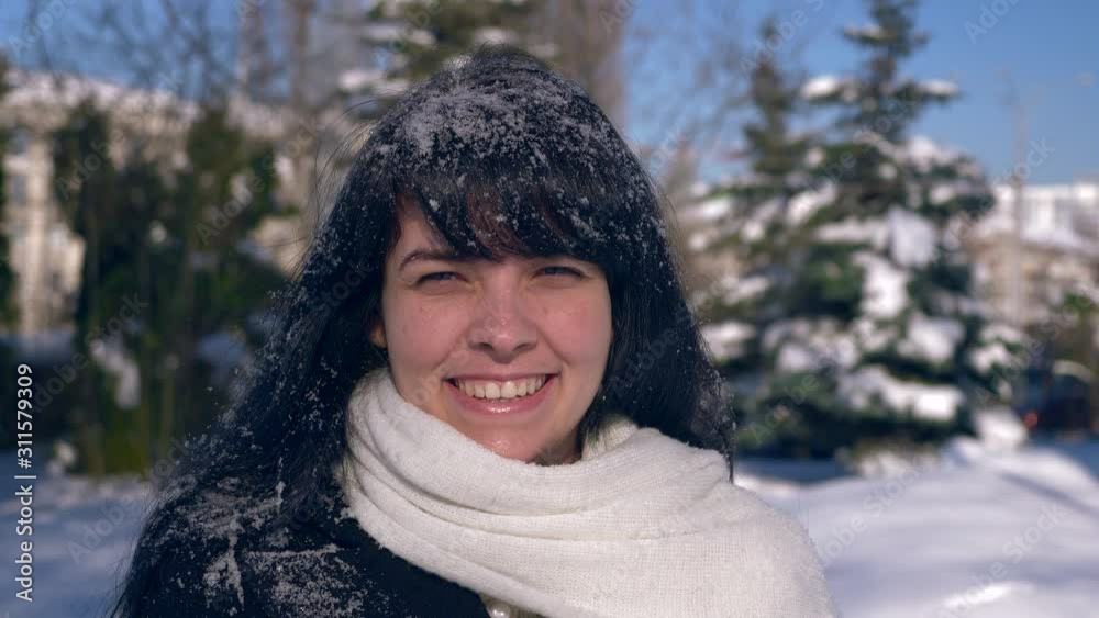 Happy Smiling Girl Covered With Snow Snowflakes.Snow Covered Park. Winter City Life. Slow Motion 30 ... Happy Smiling Girl Covered With Snow Snowflakes.Snow Covered Park. Winter City Life. Slow Motion 30 ...