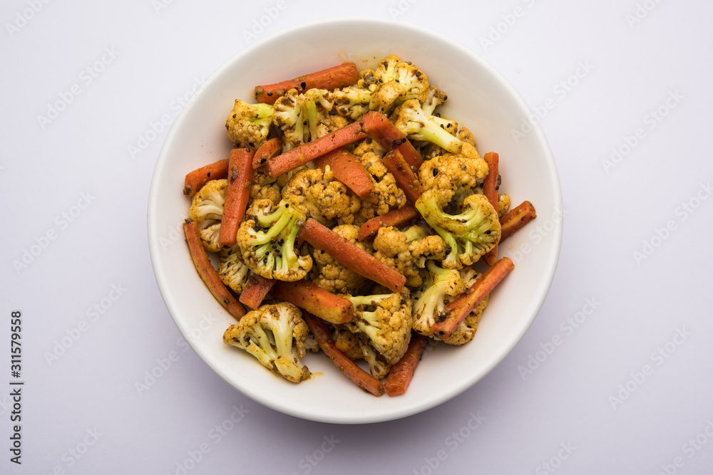 Carrots, cauliflowers achar made using PhoolGobi and Gajar. It's a sweet and sore seasonal pickle from India