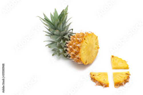 Half cut pineapple on white background