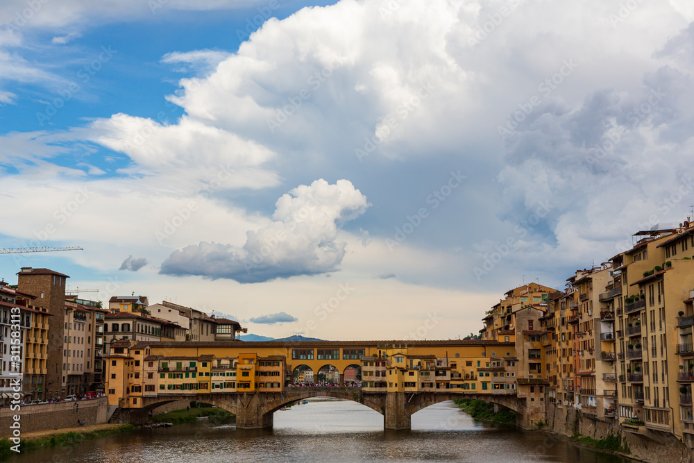 The Ponte Vecchio, a medieval stone closed-spandrel segmental arch bridge over the Arno River, in Florence, Italy, noted for still having shops built along it. The Ponte Vecchio, a medieval stone closed-spandrel segmental arch bridge over the Arno River, in Florence, Italy, noted for still having shops built along it.