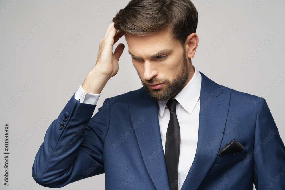 Studuo shot of thinking businessman wearing suit Studuo shot of thinking businessman wearing suit
