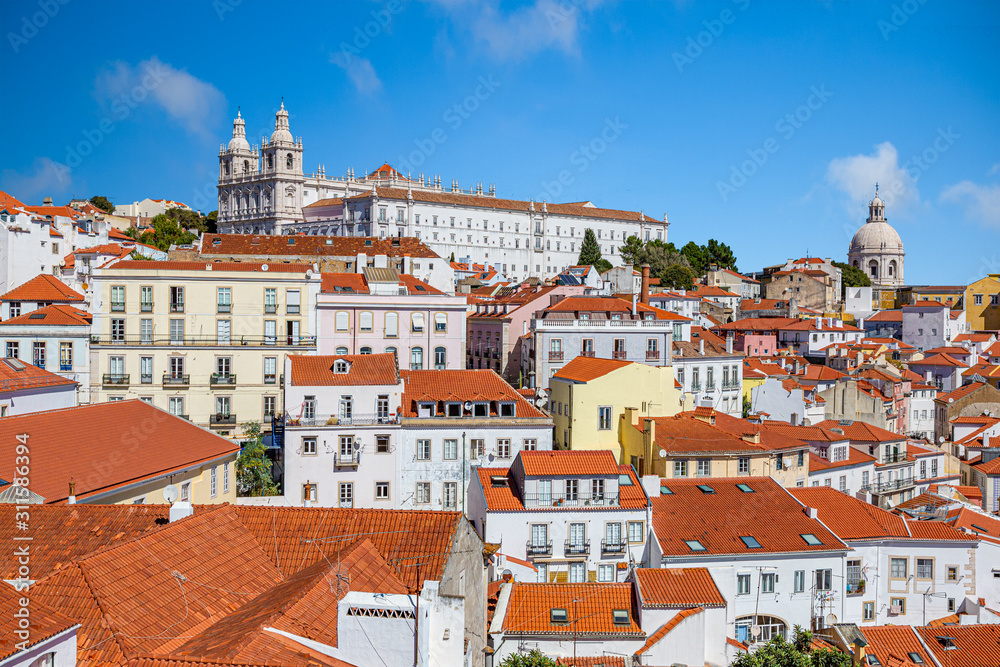 Picture over roofs of old city in Lisboa with church of Sao Vicennte of Fora and Igreja de Santa Engracia in summer