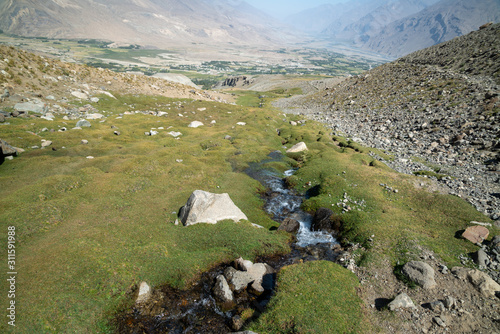 Trekking in Ishkashim green valley, mountains in Afghanistan photo