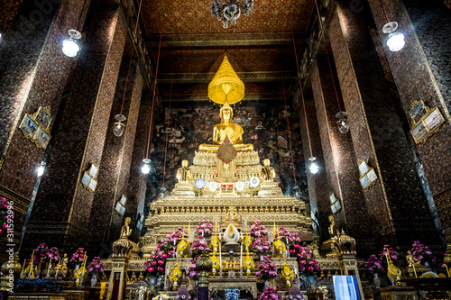 Golden antique buddha statue. Buddha image in a temple in Bangkok, Thailand. © Napob