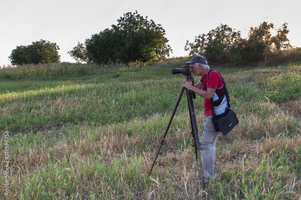 Nature photographer with digital camera. Nature photographer with digital camera.
