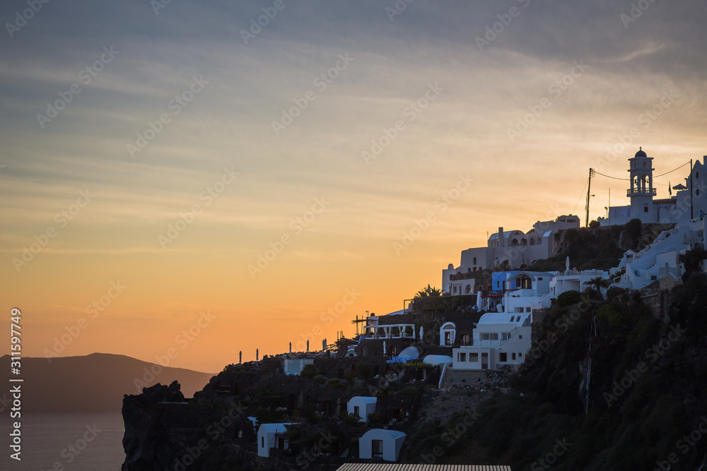 View of the town of Imerovigli, on the Greek island of Santorini at sunset. No people, copy space.