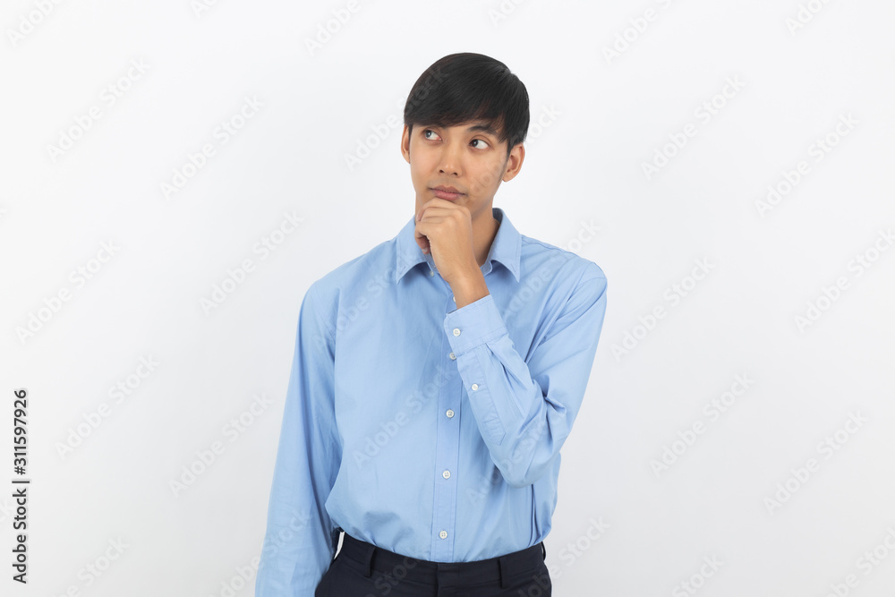 Young handsome asian business man thinking an idea while looking up isolated on white background. Young handsome asian business man thinking an idea while looking up isolated on white background.