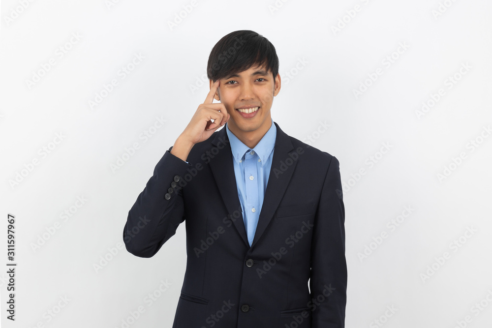 Young handsome asian business man thinking an idea while looking up isolated on white background. Young handsome asian business man thinking an idea while looking up isolated on white background.