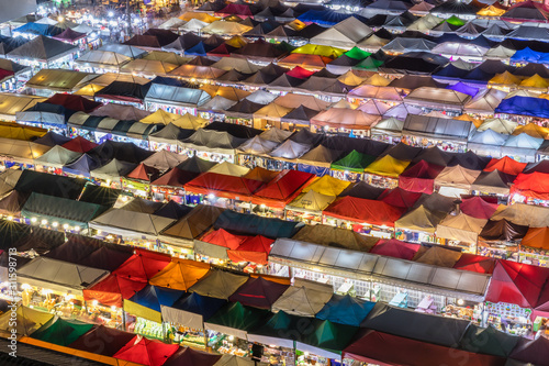 Food Stalls and vendors lit up at the Ratchada Night Market in Bangkok
