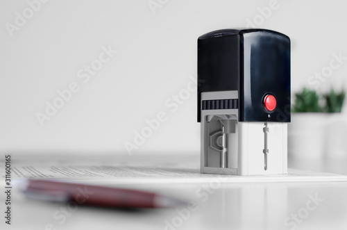 Bild auf Leinwand Lawyer or notary accessories. Stamp and fountain pen on the table