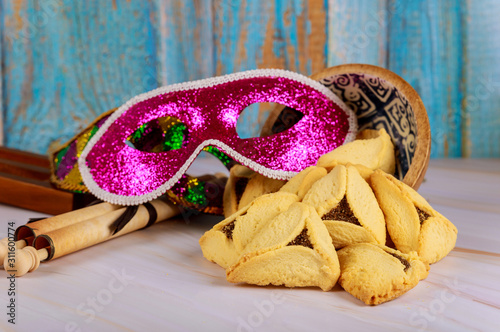 Hamantaschen cookies hamans ears, Purim celebration mask and noisemaker