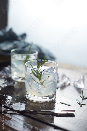 lemonade in glass with rosemary. .