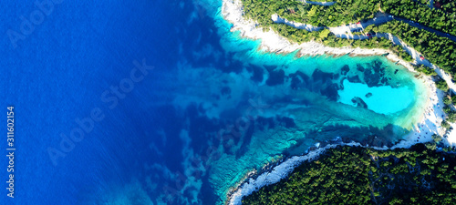 Aerial drone ultra wide photo of paradise turquoise bay with clear sea in exotic Caribbean island