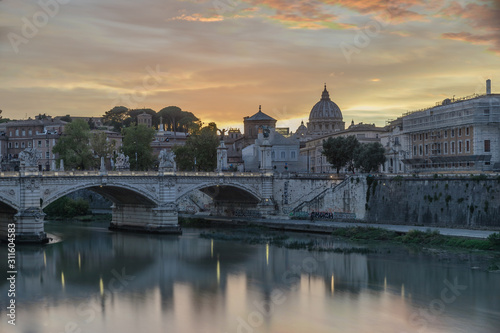 Bridge and Tiber River with view of Saint Peters Church in Rome © Timon