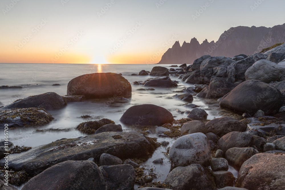 Long exposure of rocky coastline in Senja, Norway