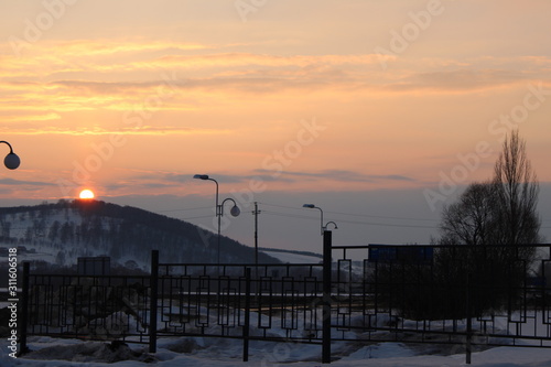 Sunset over the mountain in winter.