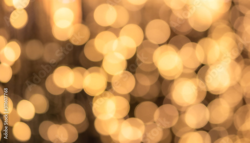 Abstract bokeh light background, warm tone, yellow orange color