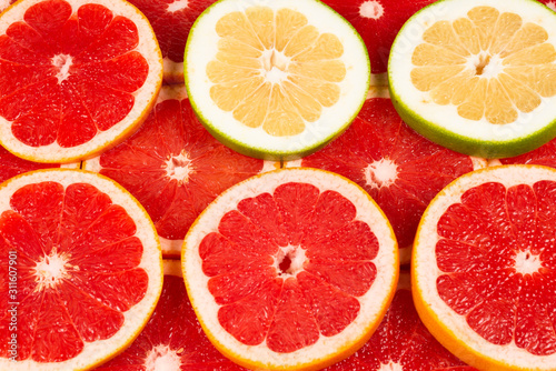 Pomelo and grapefruit slices background.