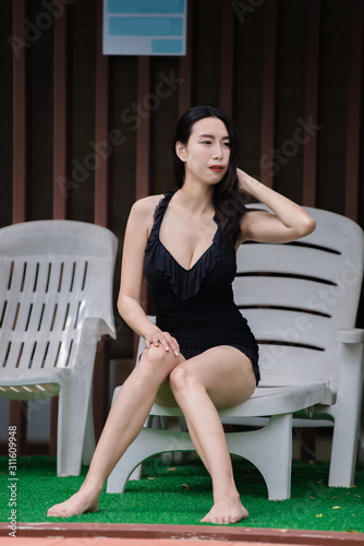 Portrait of asian sexy woman at swimming pool,Thailand has a slim body shape,Healthy woman concept,Fashion bikini summer © reewungjunerr