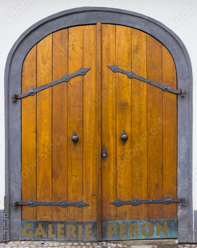 Wooden door with forged elements in high resolution