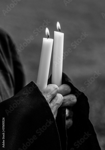 Hands Holding Candles