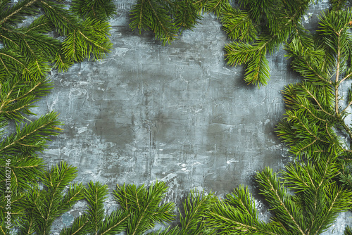 Christmas background with pine branches on the rustic background. Selective focus. Shallow depth of field. © maxandrew